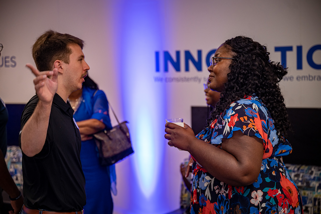 UMRF Ventures student employee talking to visitors