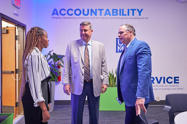 UMRF Ventures student employee talking to visitors