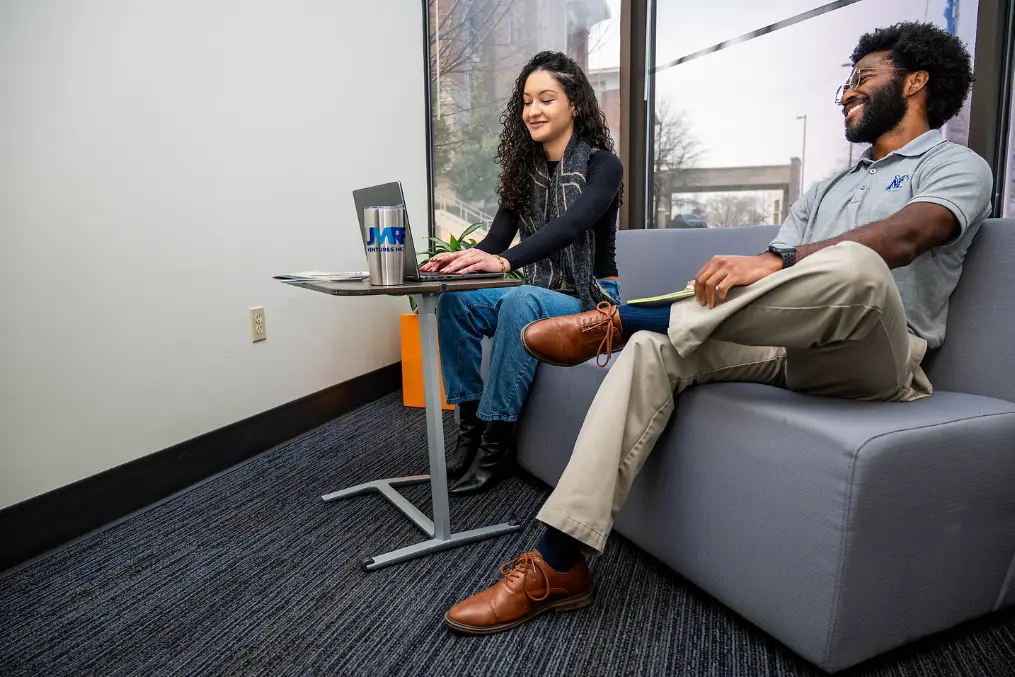 student employees sitting down and talking