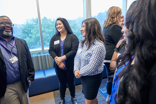 people talking at networking event